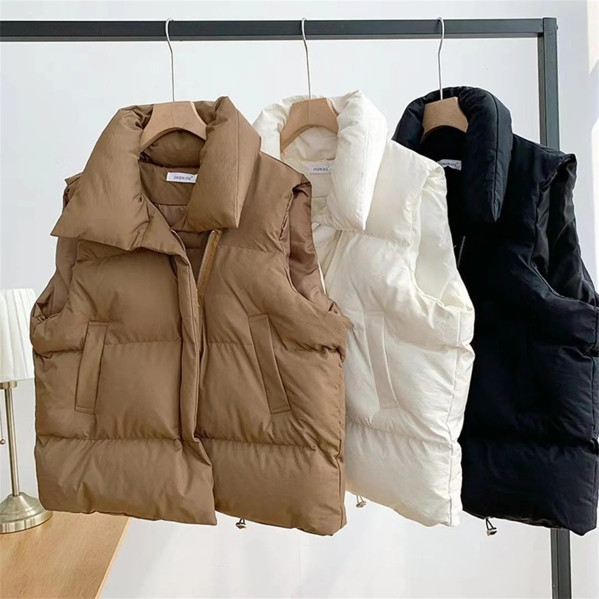Women Fashion Autumn New 2025 Stand Collar Elegant Down Coats Warm Outerwear Casual Belt Sleeveless Winter Women Vests Jackets